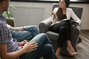 Image of a couple meeting with a couples therapist for a couples counseling session. During marriage counseling in Colorado Springs you will learn to identify your needs and how to effectively communicate them with your partner. Start reconnecting again with support from couples therapy.