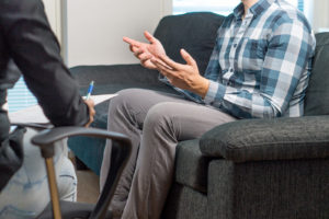 Image of a man in a blue plaid shirt during a psychosexual evaluation in Colorado Springs, Colorado. Representing what you can expect from a sex offender evaluation or sex offender risk assessment in Colorado Springs, CO.