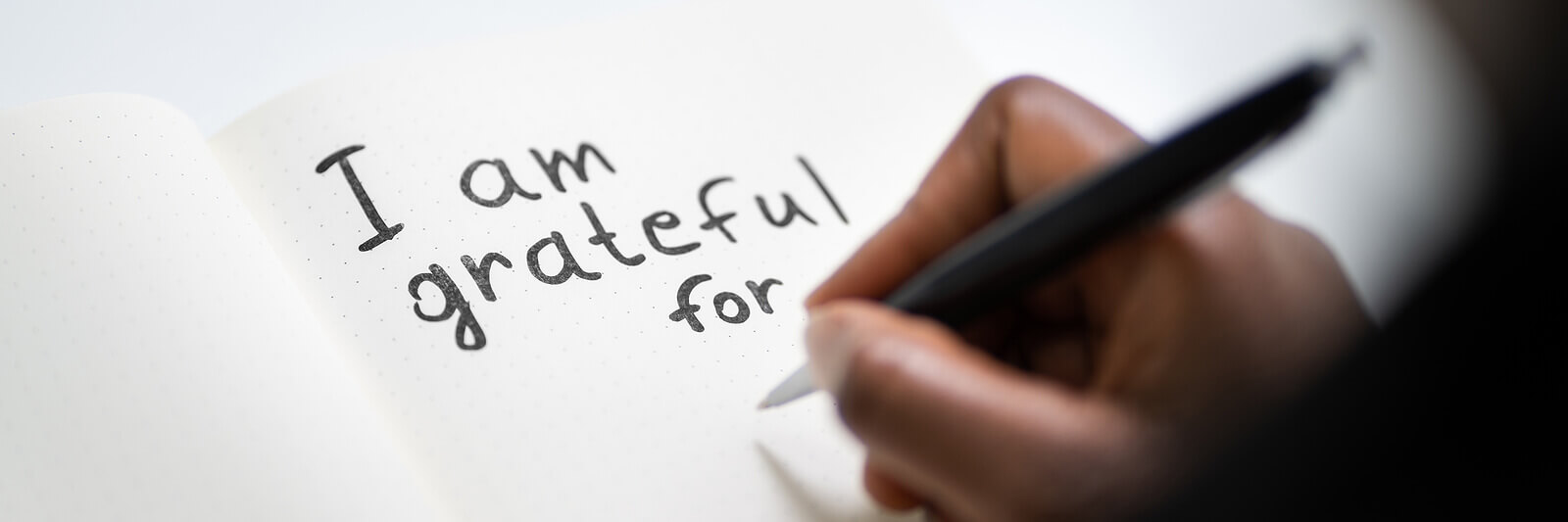 Image of "I am grateful for" written in a journal. Representing something you can do to address body image anxiety in Colorado Springs, CO. This holiday season we can help you feel more comfortable with anxiety treatment.