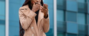 Image of a woman covering her face looking upset. Representing someone experiencing traumatic grief. She could benefit from online therapy with a trauma therapist in Colorado Springs, CO.